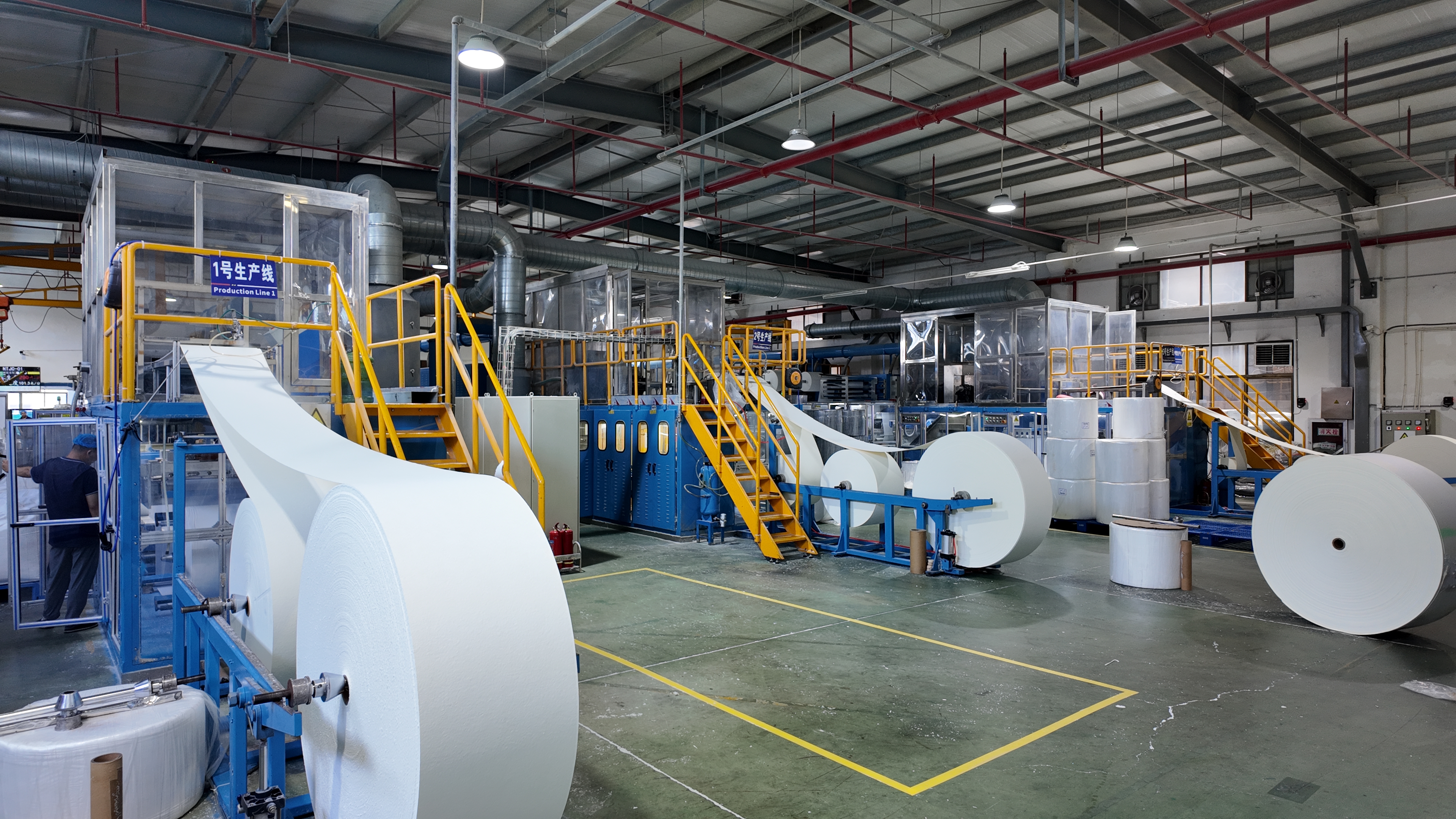 Automated absorbent product converting line